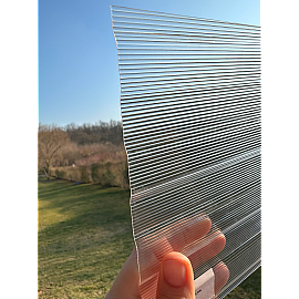 Policarbonat compact/solid cutat trapez 50/5, grosime 1mm, rolă 10 ml,  protejat UV, lățime 1.26m, transparent-clar (preț/rolă)